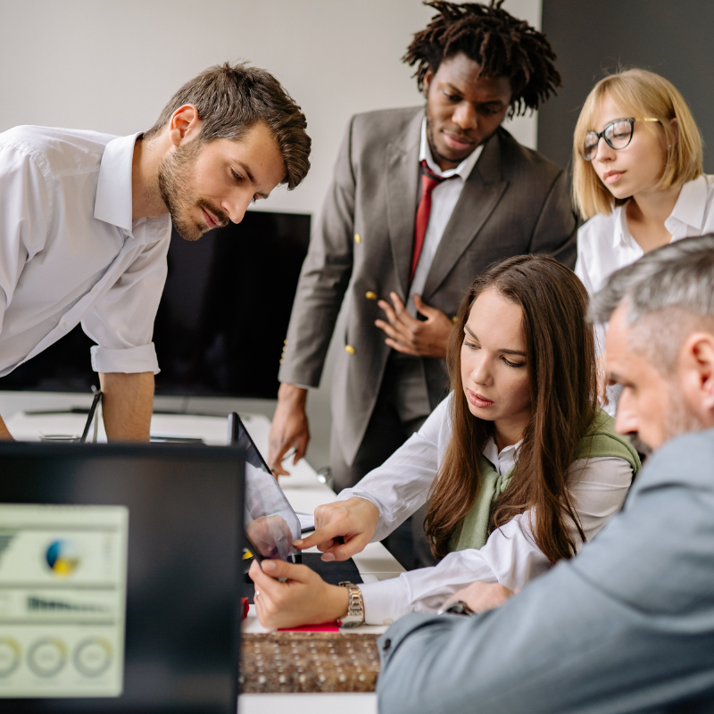 Team studying documents on a table